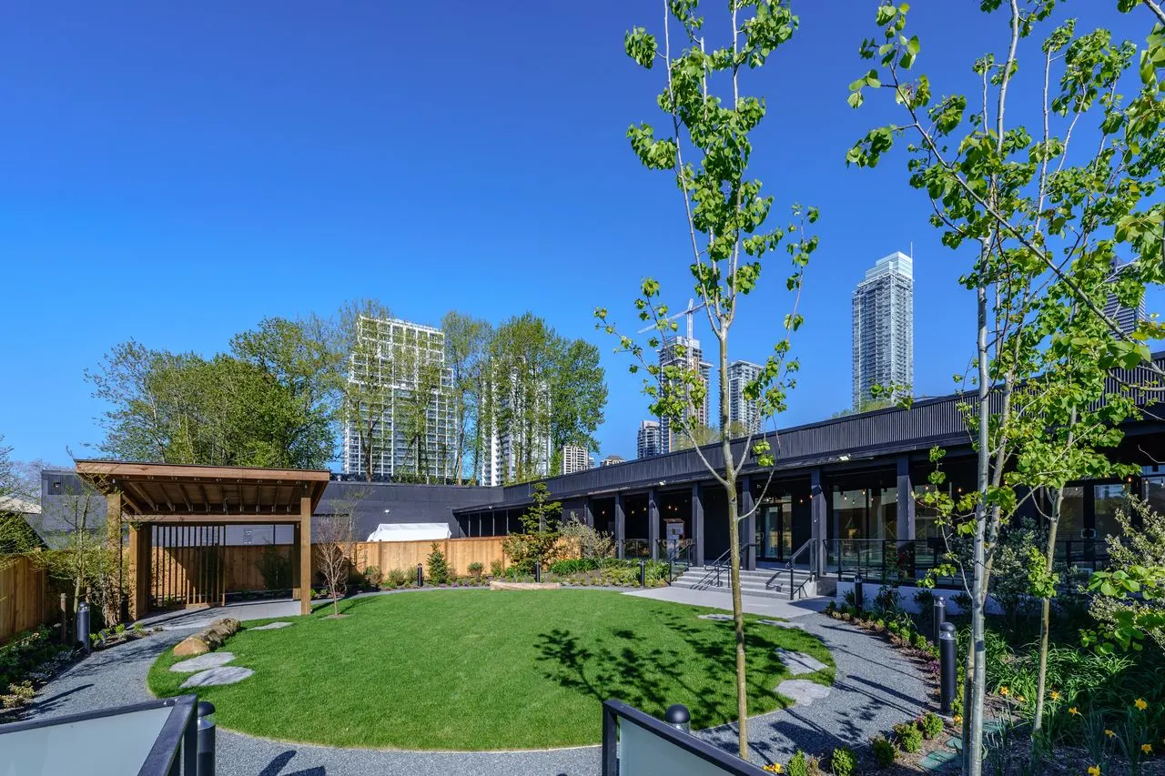 Circular lawn with gravel path and timber pavilion at The Grove Presentation Centre