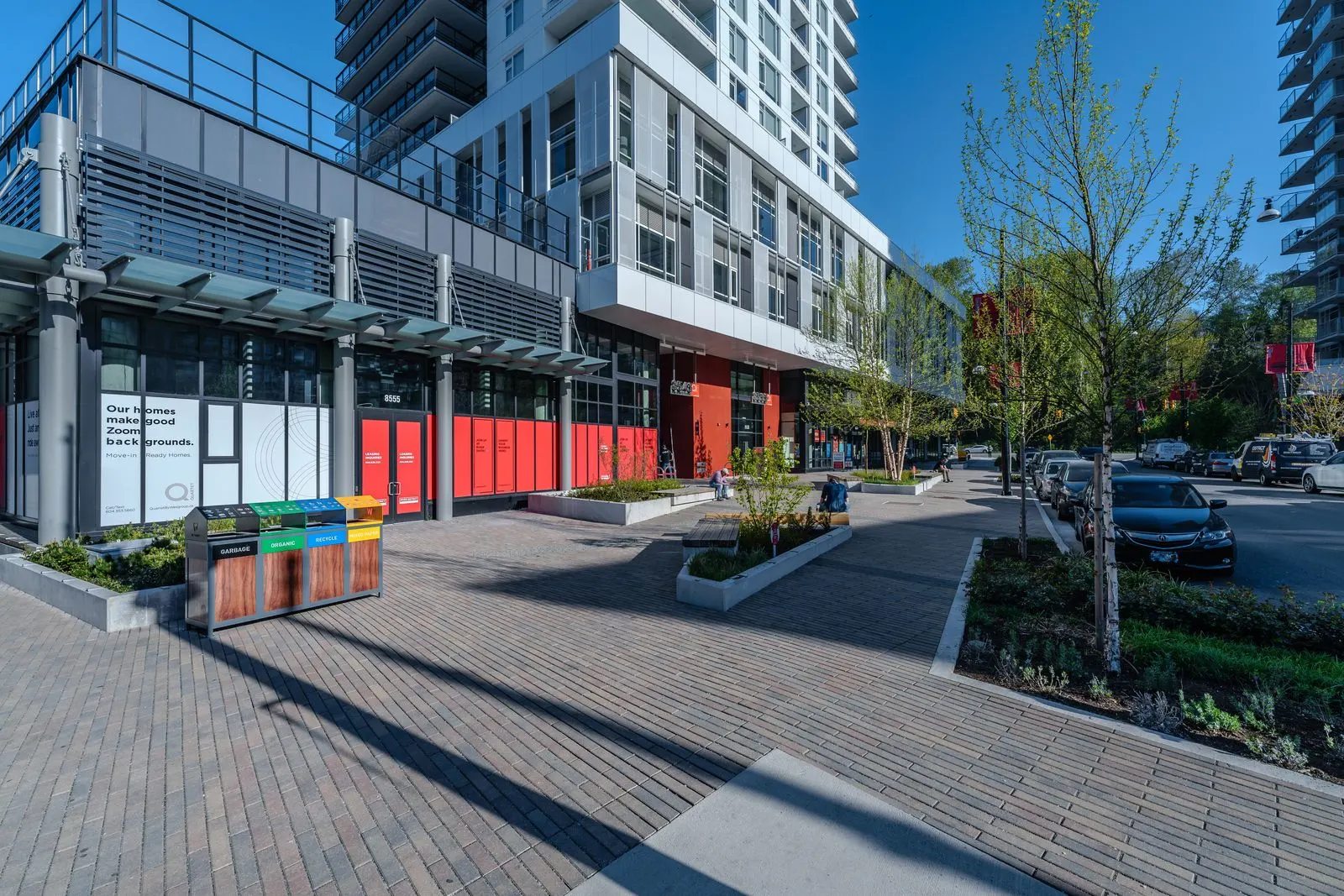 Paver plaza and street trees at a mixed-use building at Quartet