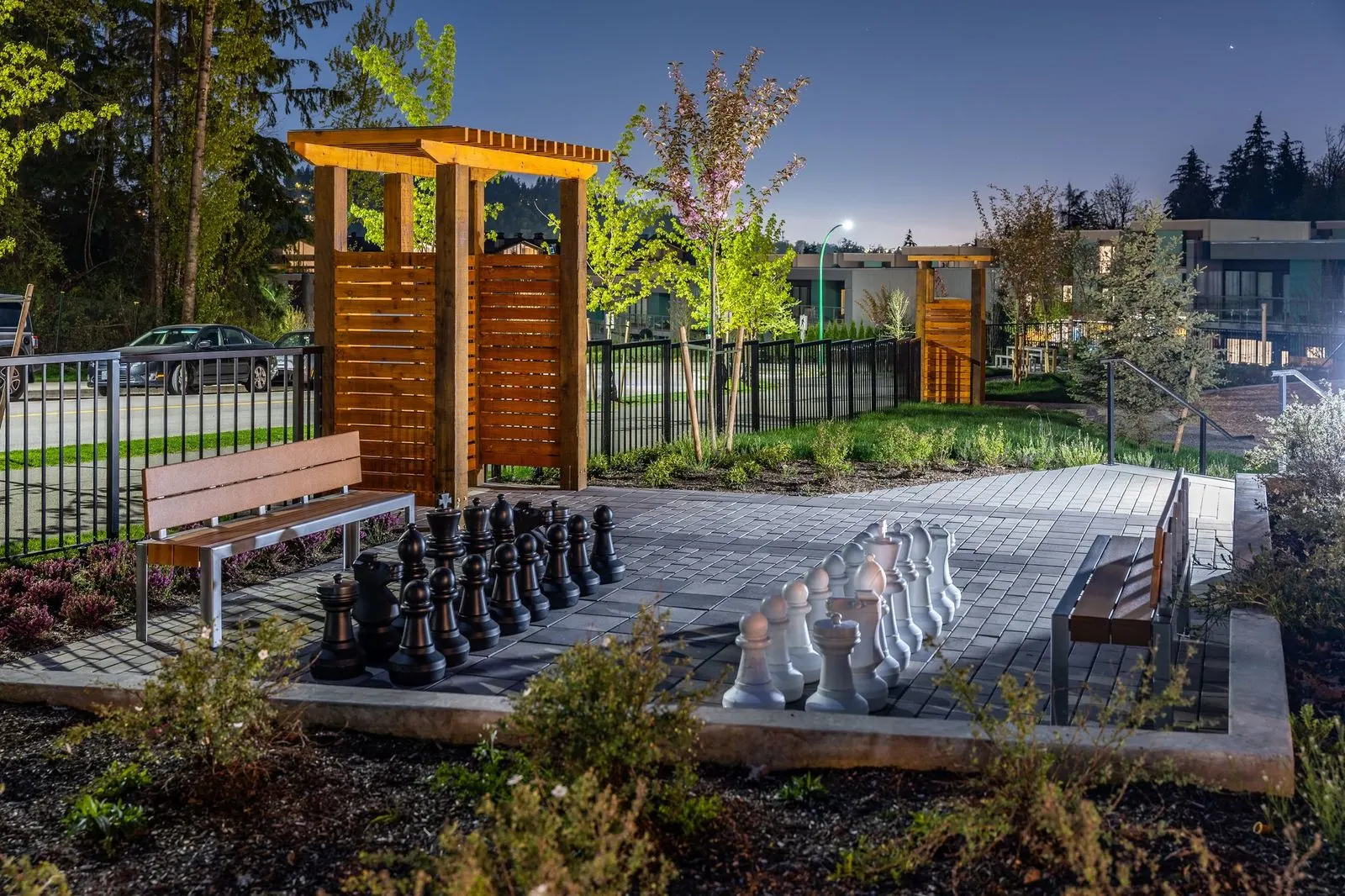 Giant chess set and timber arbour on a paved area at Seymour Village Amenity Park