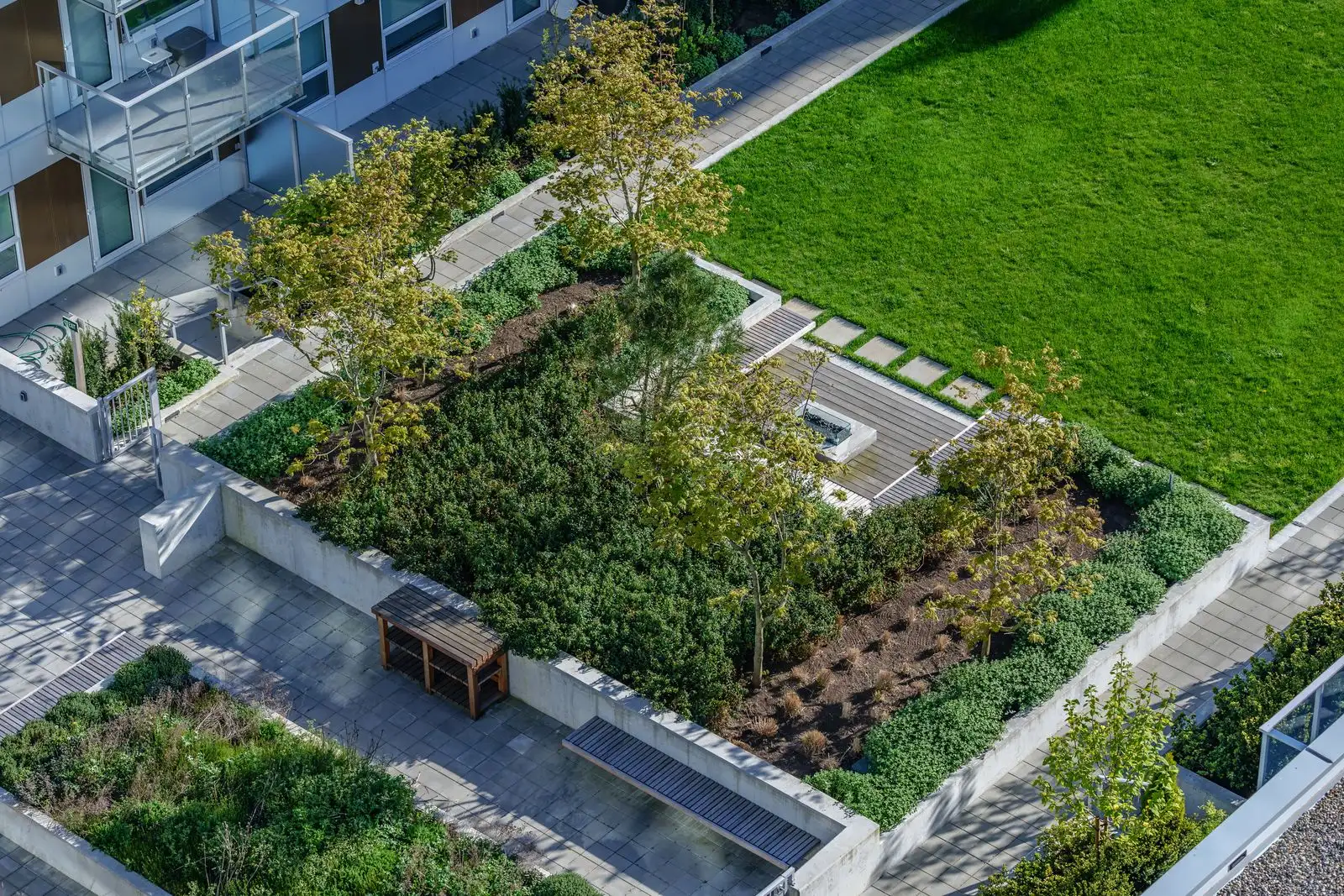 Overhead view of courtyard planting beds and lawn at River Park Place 2