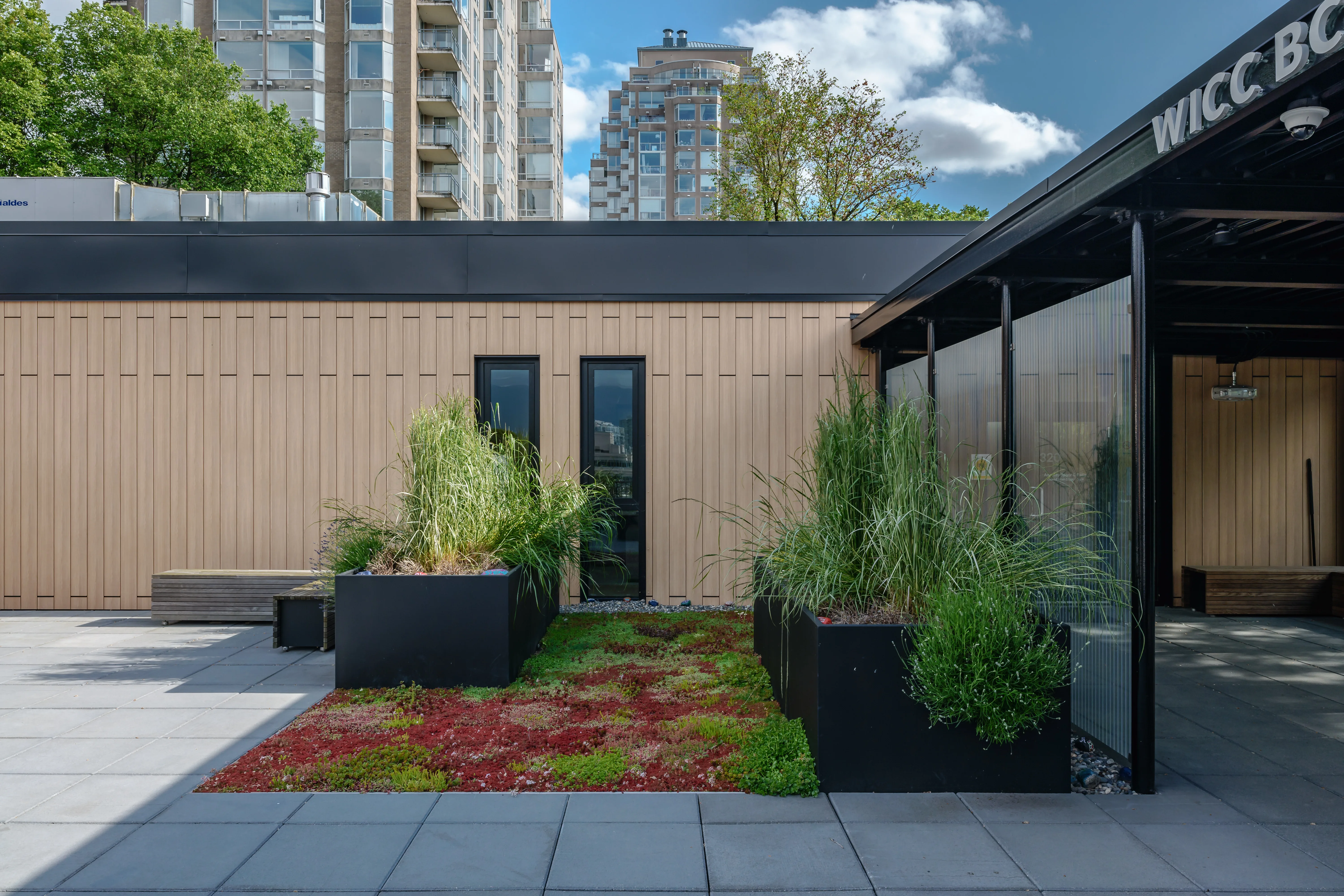 Paved patio with planters beside a small building at Canadian Cancer Society