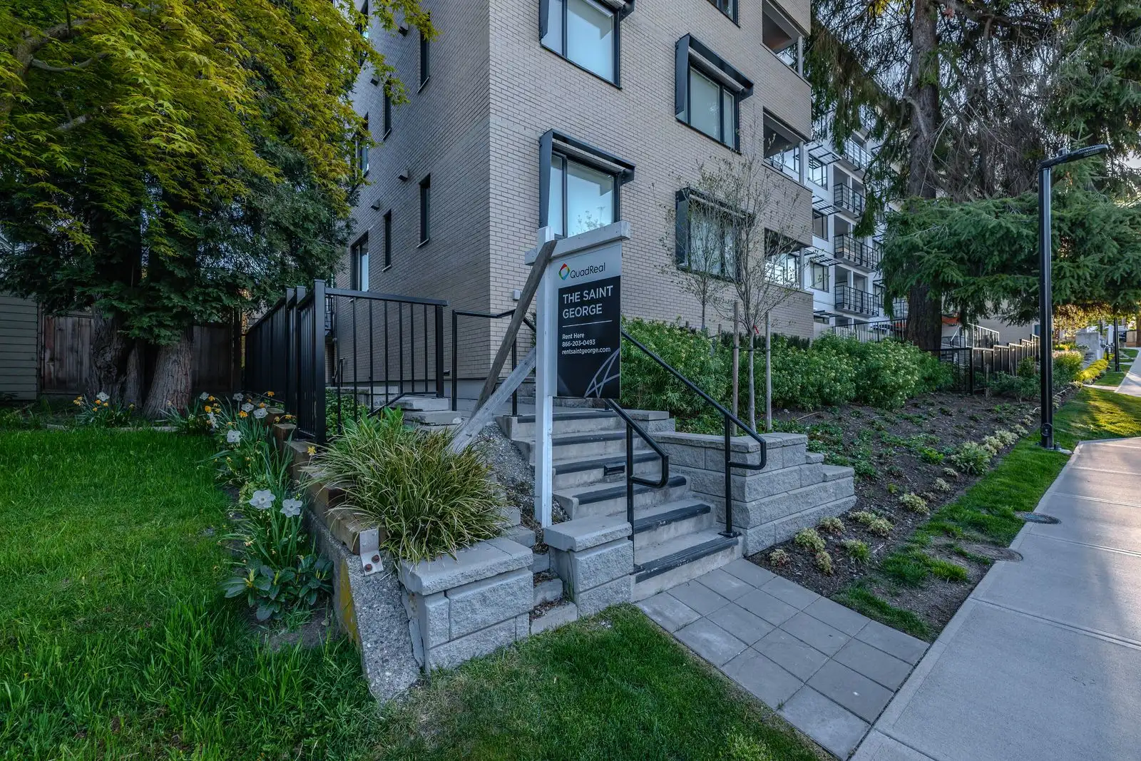 Entry stairs with lawn and planting at The Saint George