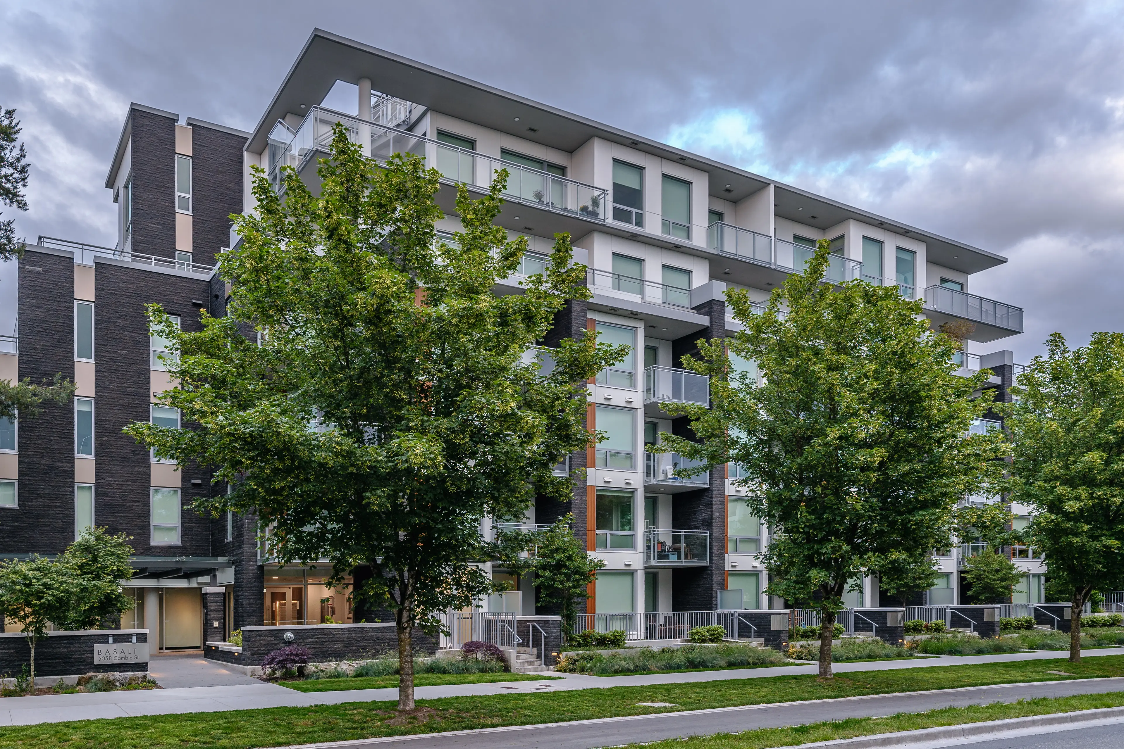 Street trees in front of a mid-rise residential building at Basalt