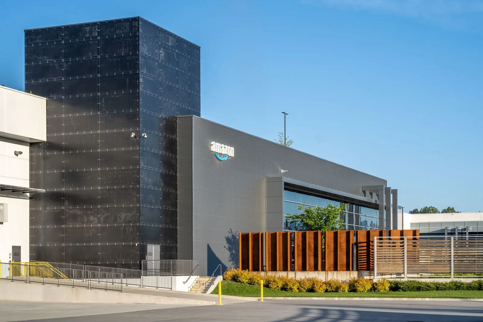 Planting and weathering steel screen at a warehouse at Riverbend Amazon Warehouse