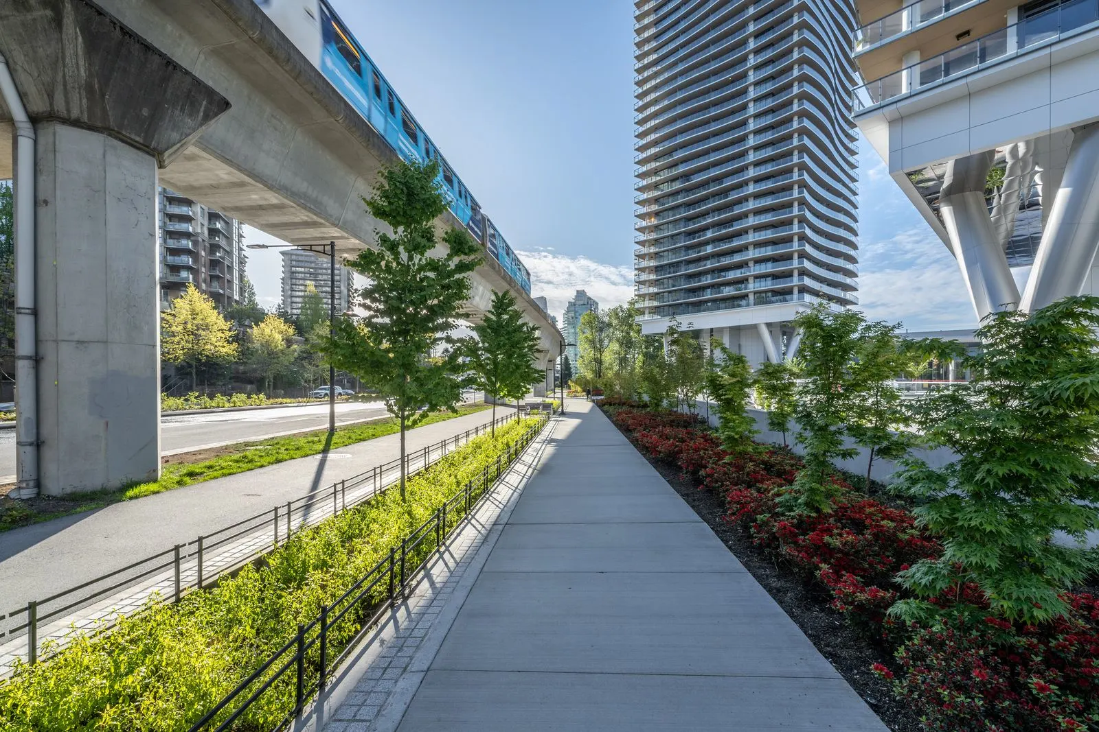 Pathway with planting under an elevated guideway at Brentwood 1B