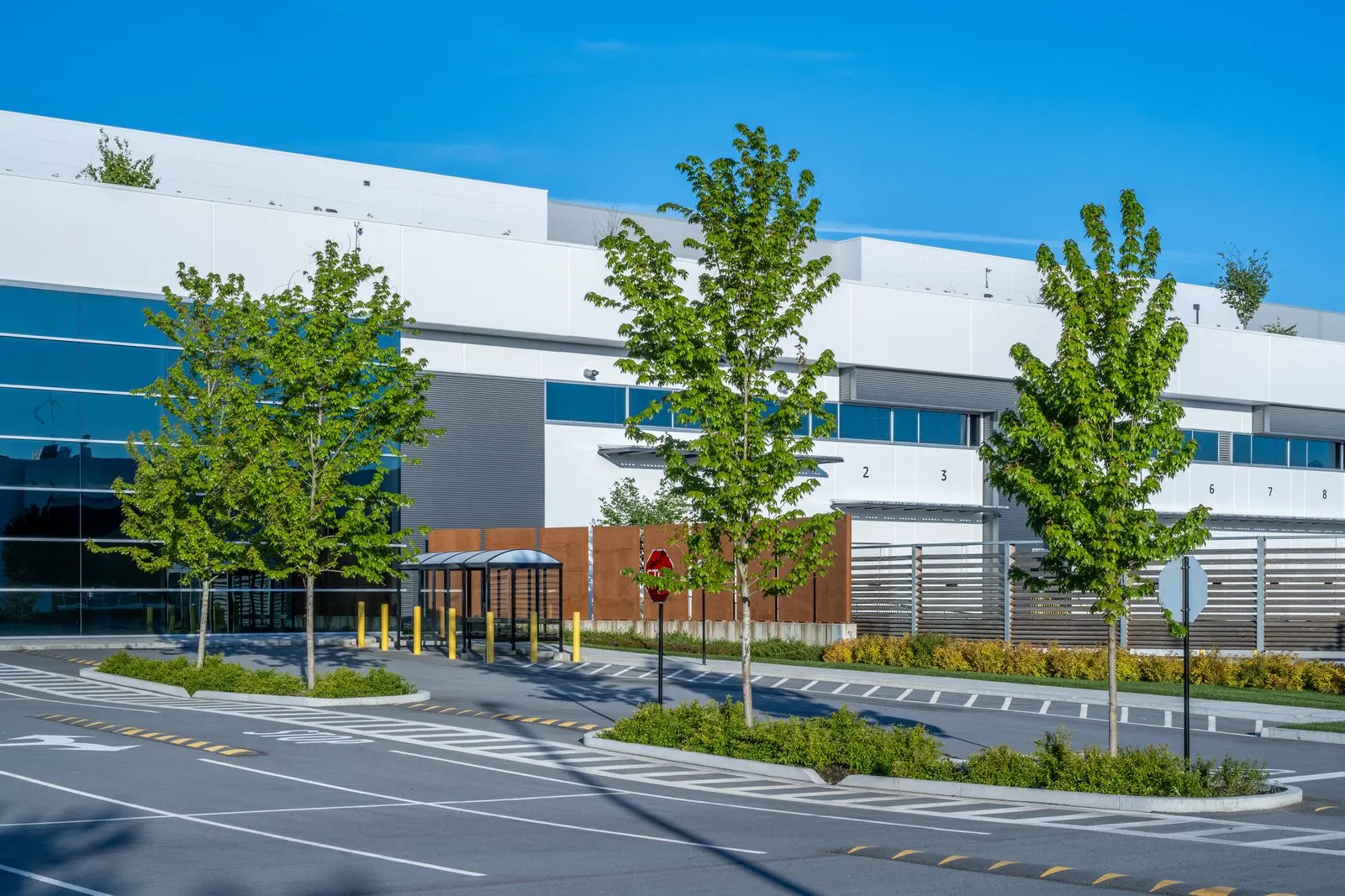 Parking lot islands with trees and planting at Riverbend Amazon Warehouse