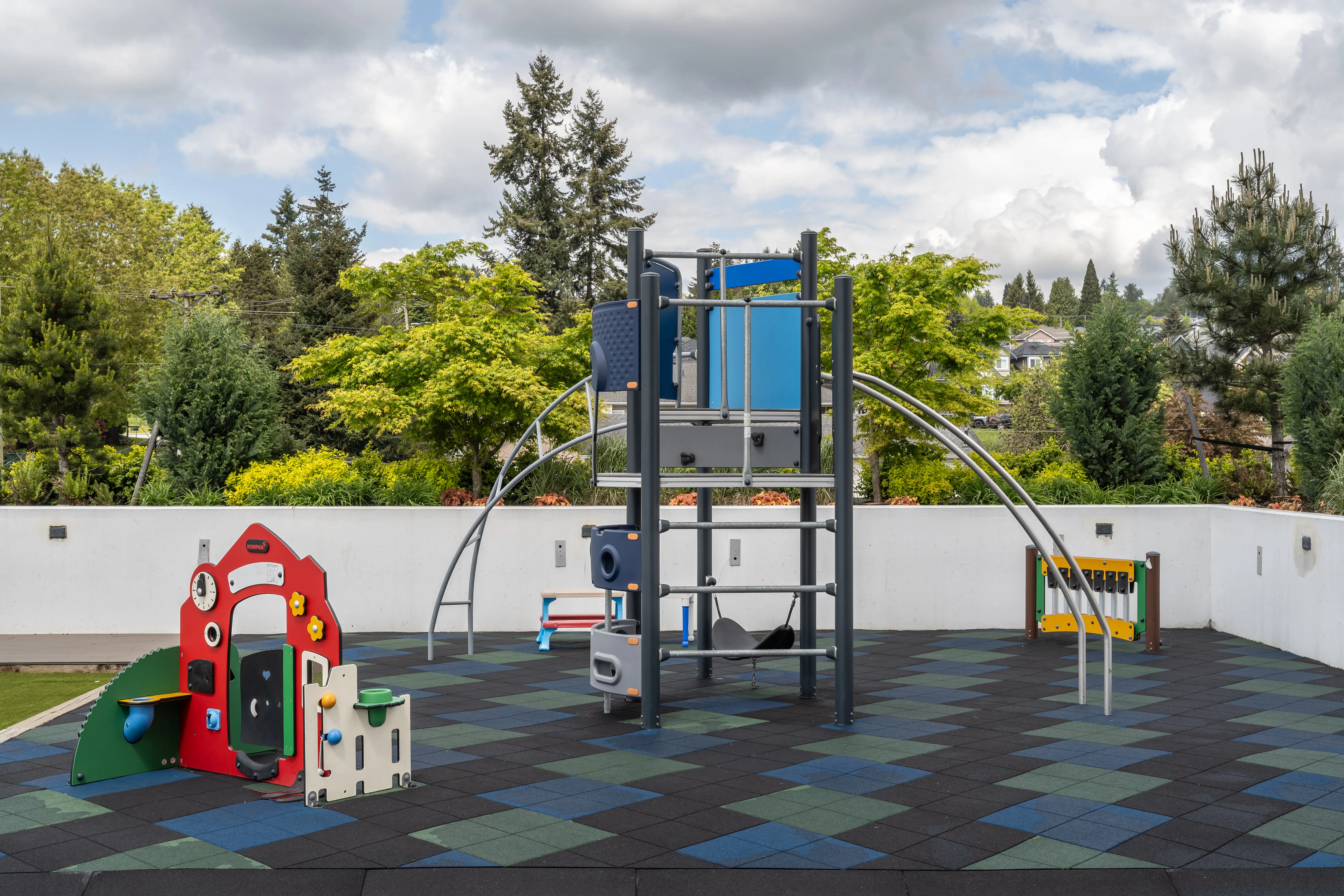 Playground with play structure on a rubber surface at Loma