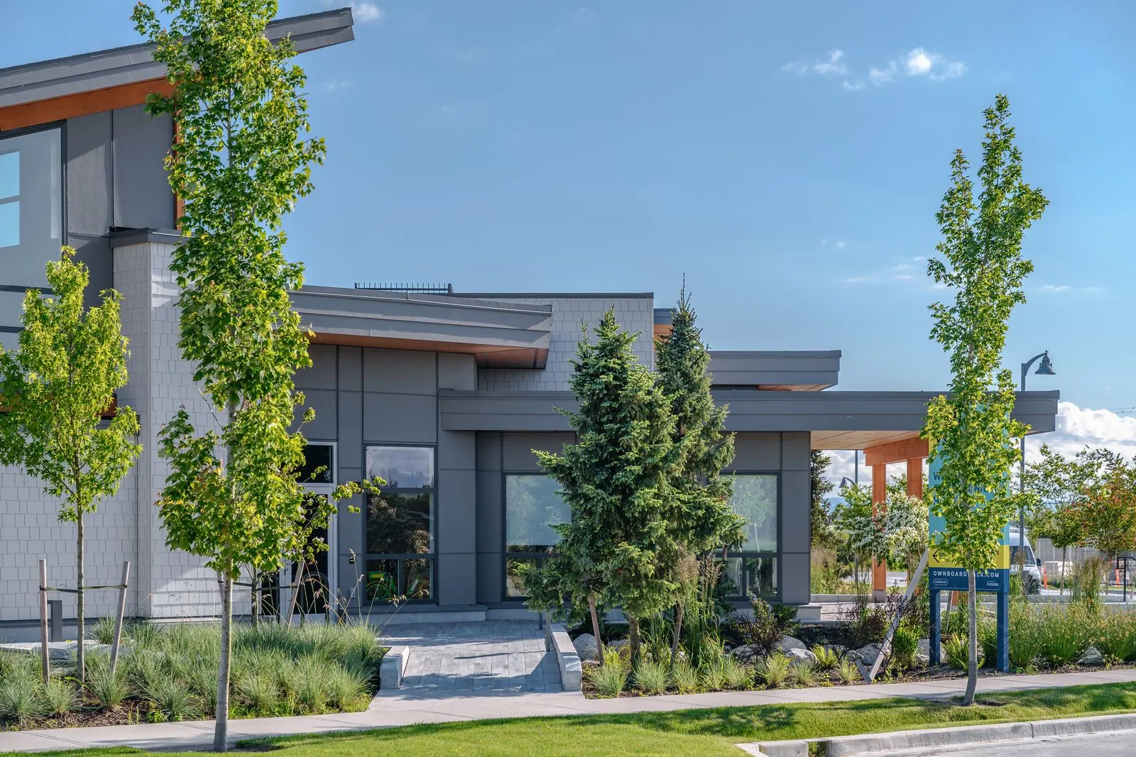 Young trees and planting around the amenity building at Boardwalk