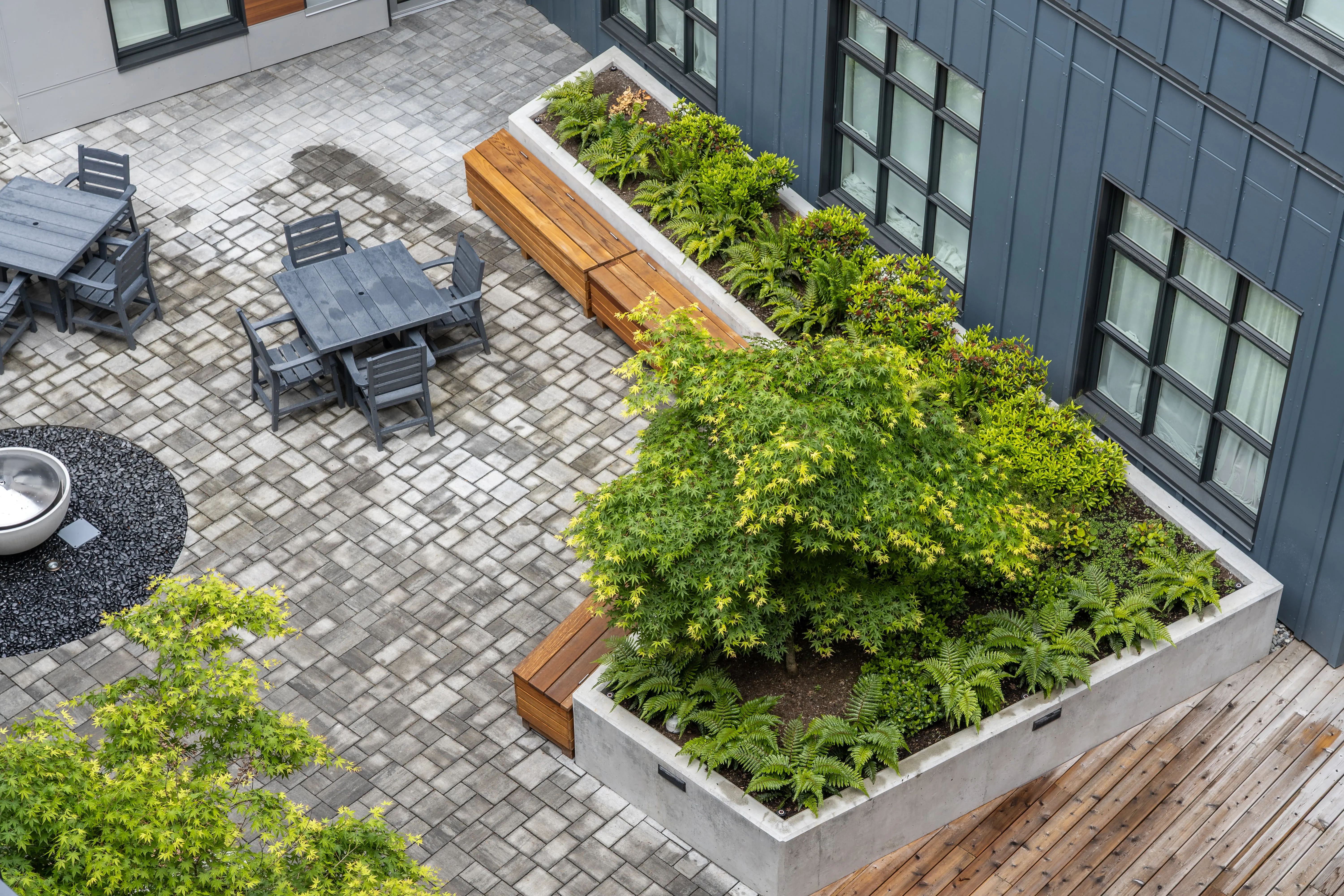 Overhead view of a raised planter and patio seating at L'Arche Community Centre