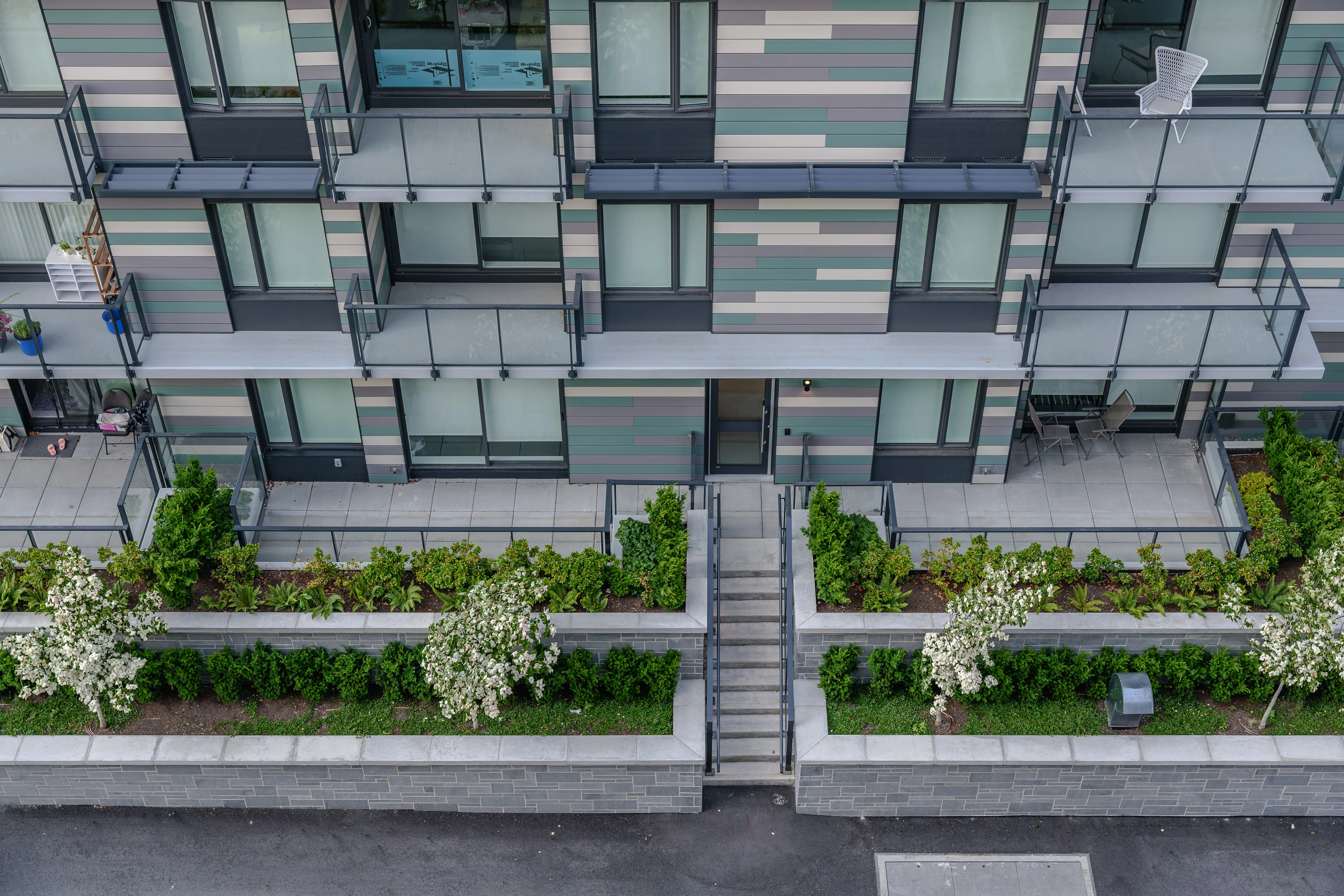 Raised planters along ground-floor patios at Parkhouse