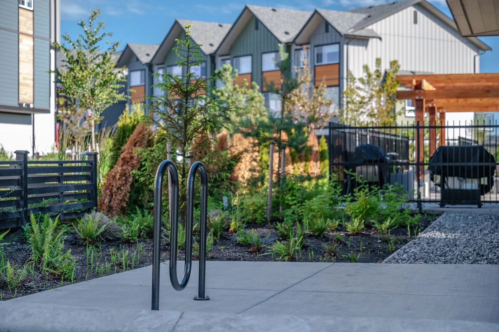 Planting beds, bike rack and barbecue area at Boardwalk
