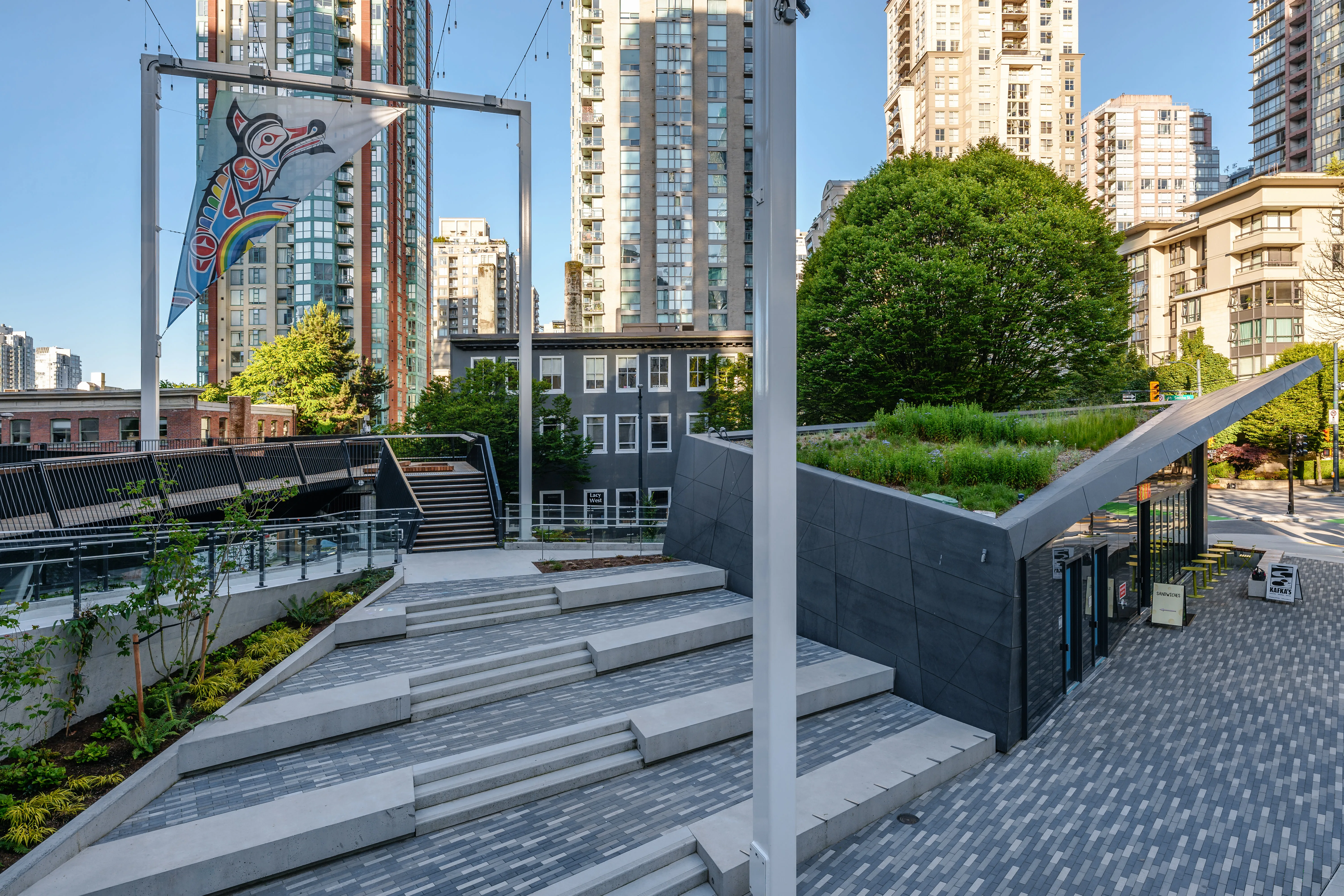 Concrete seating steps and planting in a park at Rainbow Park Downtown
