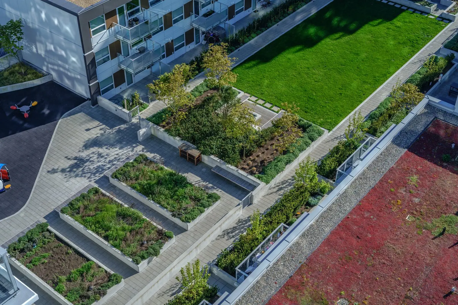 Overhead view of rooftop planting beds and lawn at River Park Place 2