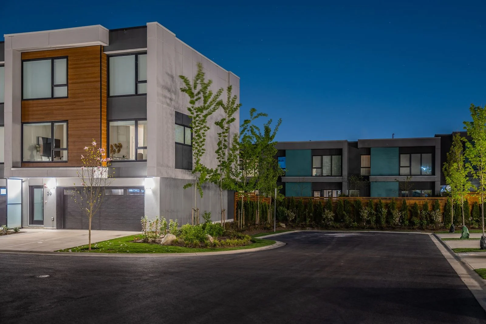 Townhome driveway and planting at dusk at Seymour Village Amenity Park