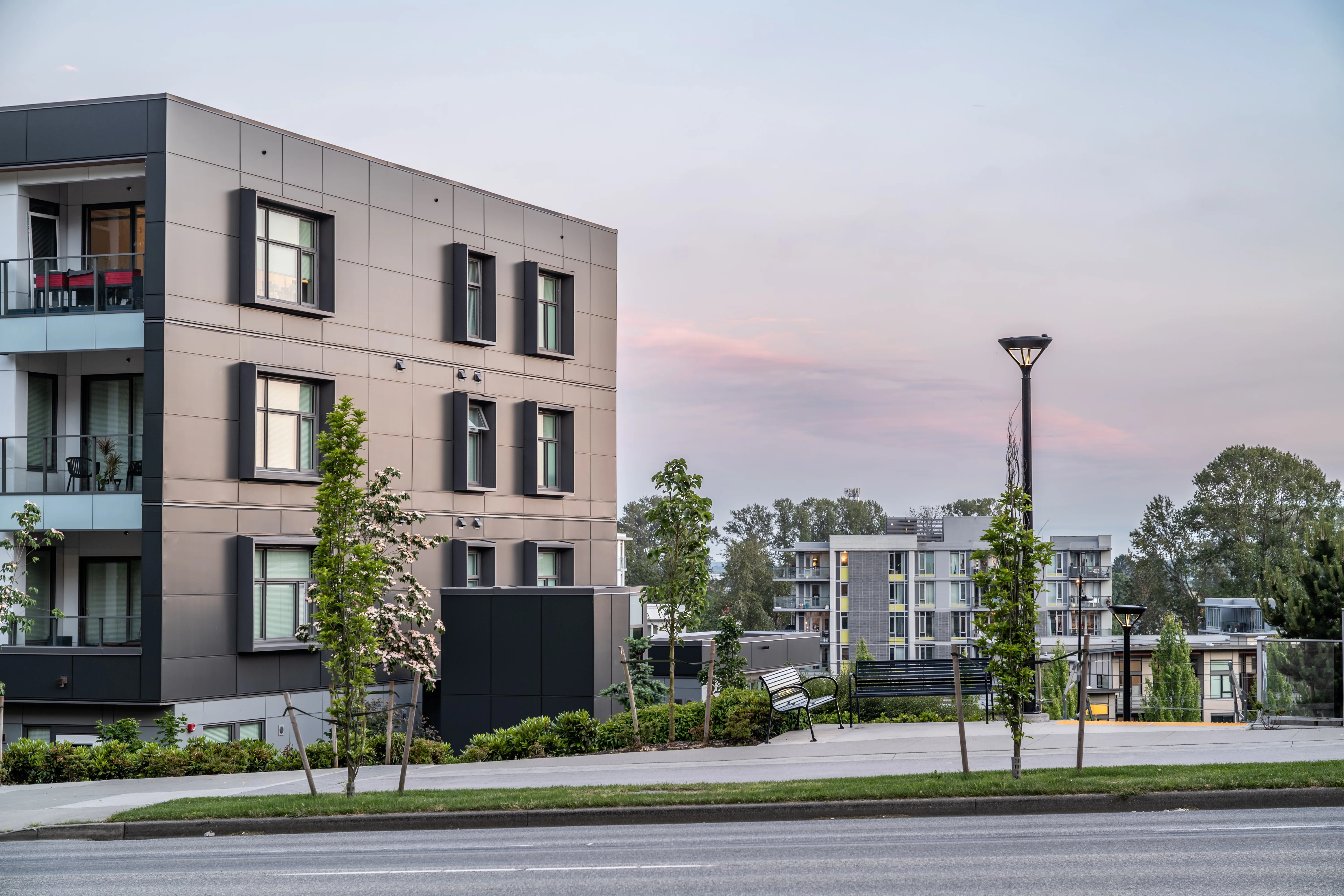Street frontage planting and light poles at a residential building at Kinship