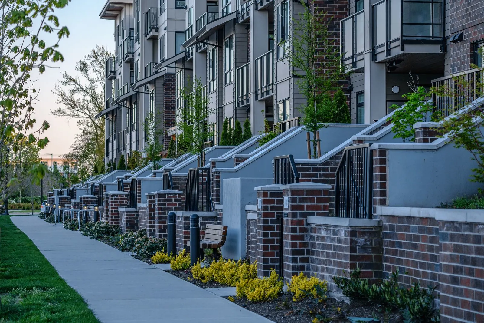 Townhome entry stairs and planting along a sidewalk at Spark