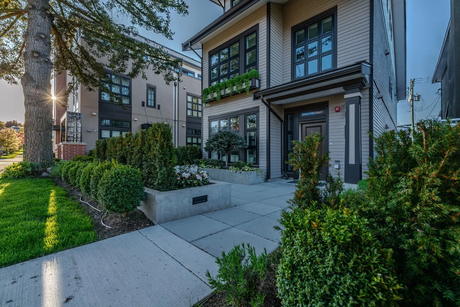 Lawn, hedges and shrub planting at a townhome entry at Westbury Townhomes
