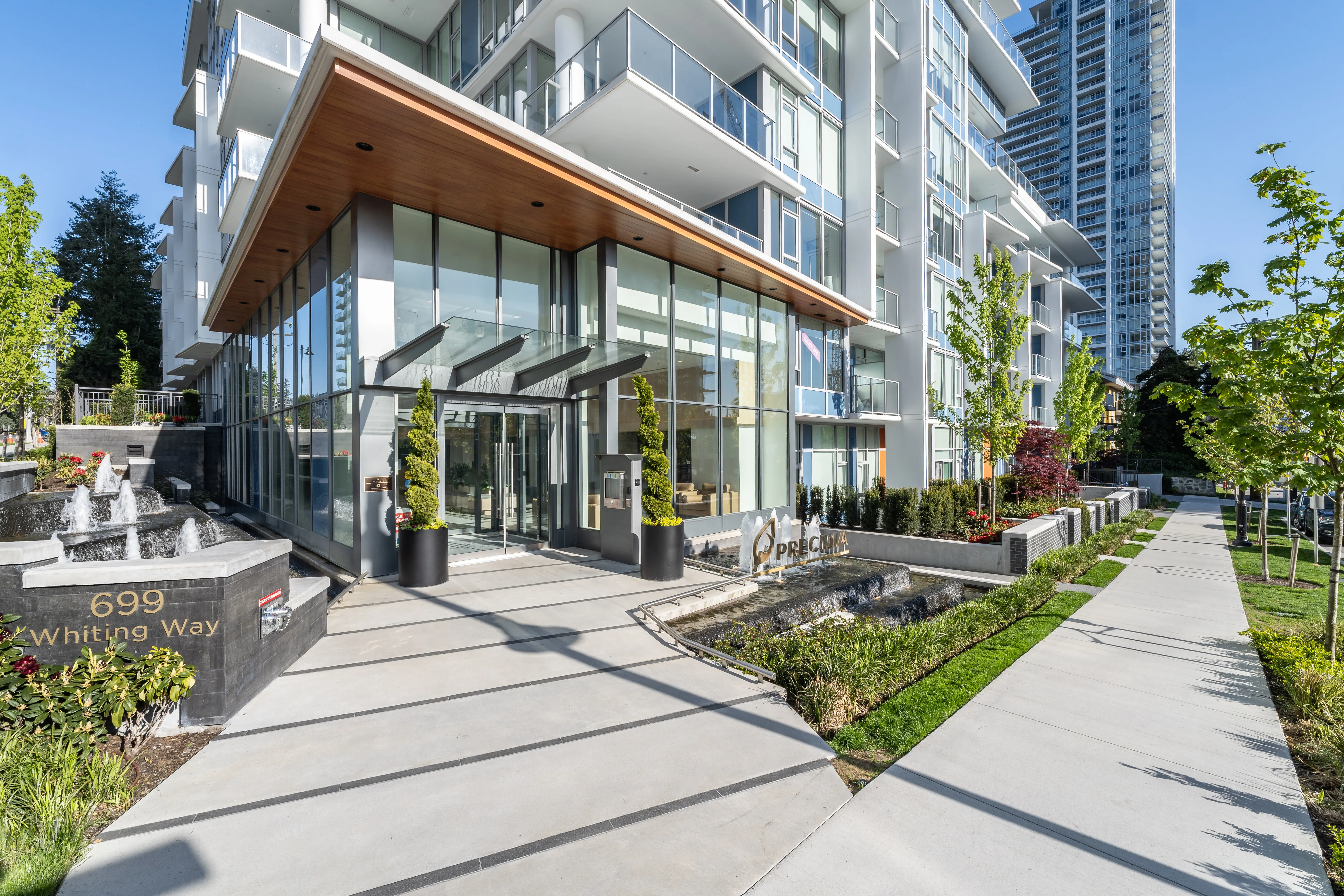 Entrance walkway and planting at a residential tower at Precidia