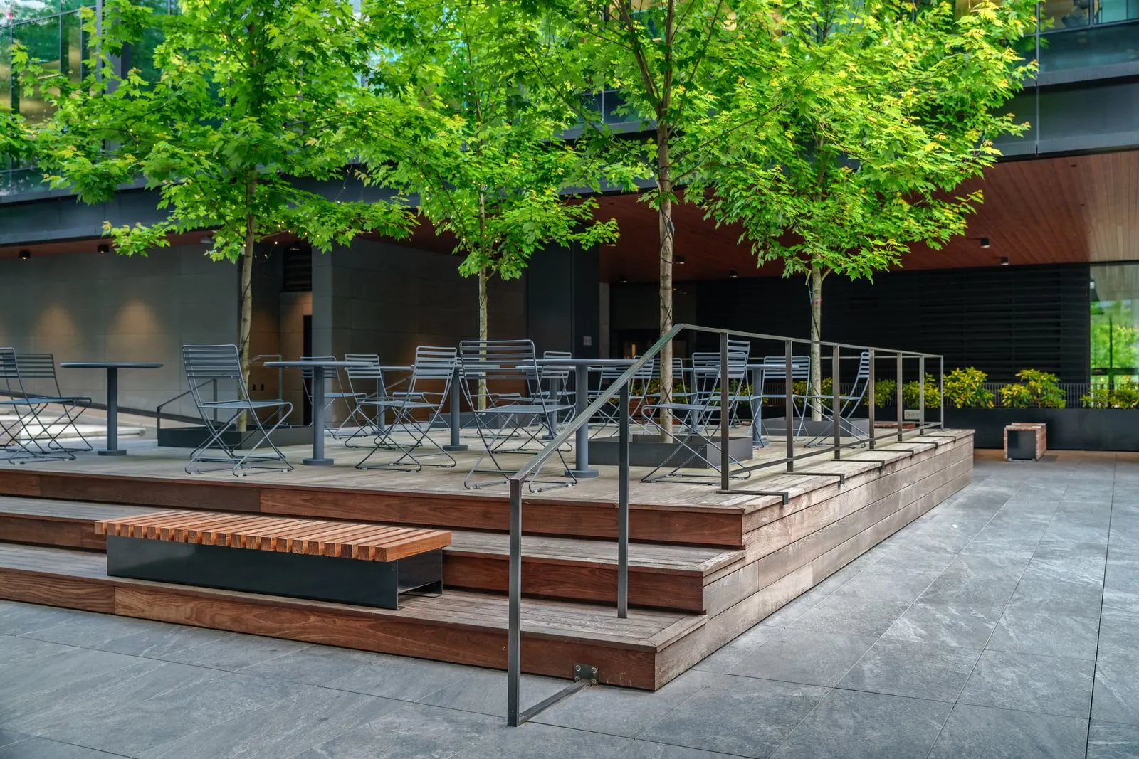 Timber stepped seating and trees on a terrace at Amazon Downtown