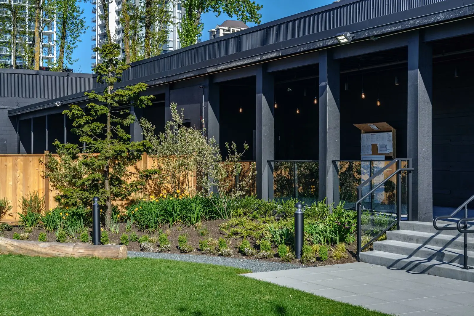 Planting beds and lawn along the building at The Grove Presentation Centre
